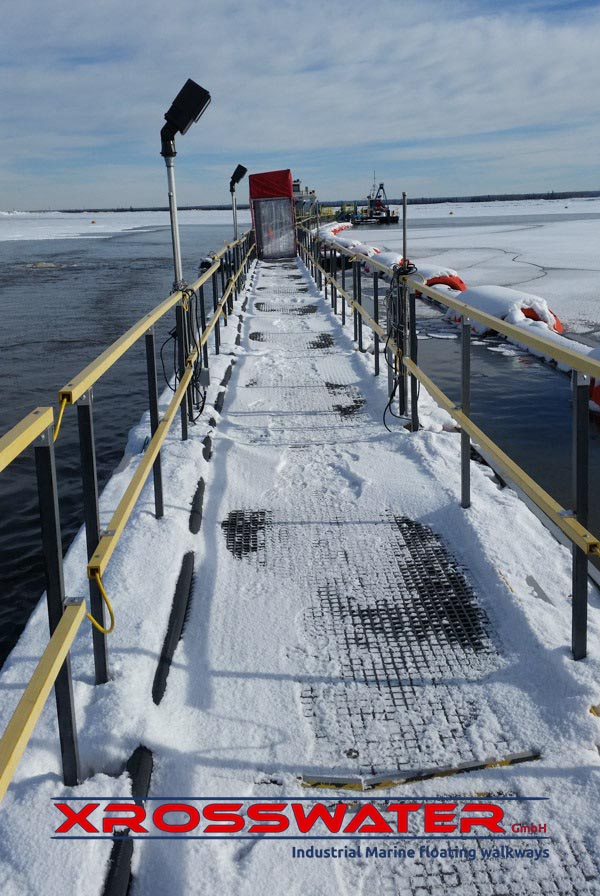 Walkways for oil tailings ponds in Canada mining project with de-icers and telescoping light poles